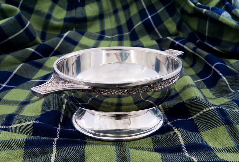 A Scottish wedding quaich on a green and black tartan