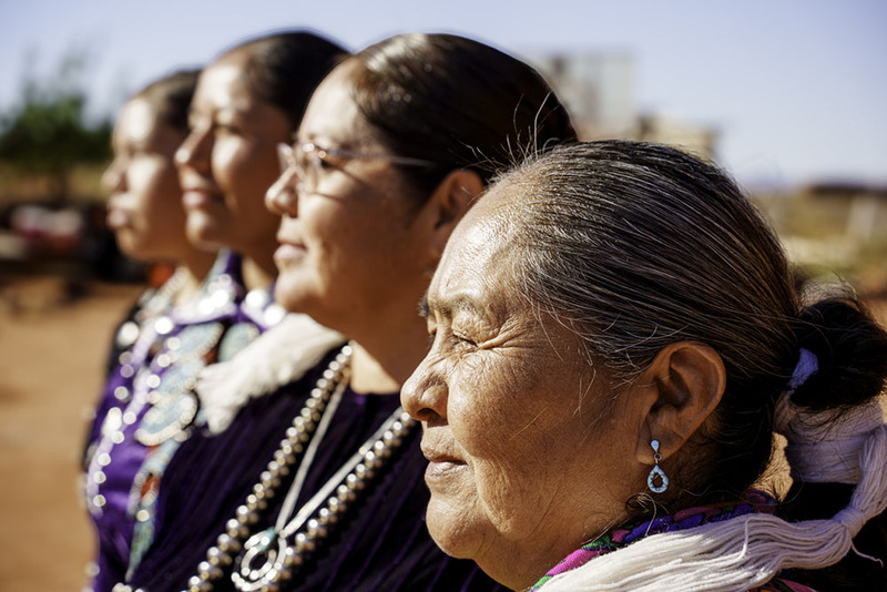Close up of four Navajo women outside on a sunny day