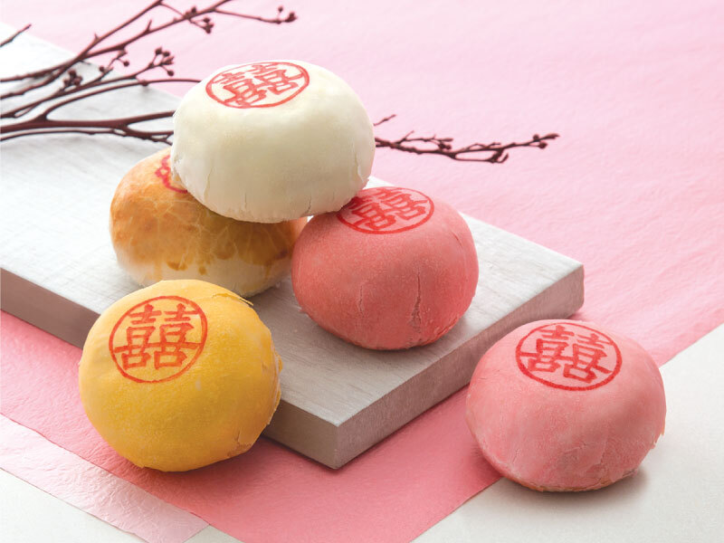 A plate with chinese wedding cakes