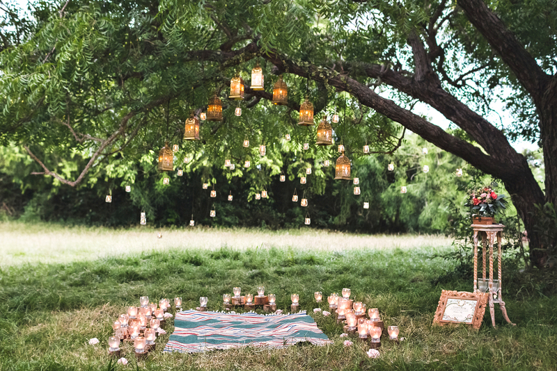 Image of a picnic or outdoor wedding ceremony in backyard or park setting.