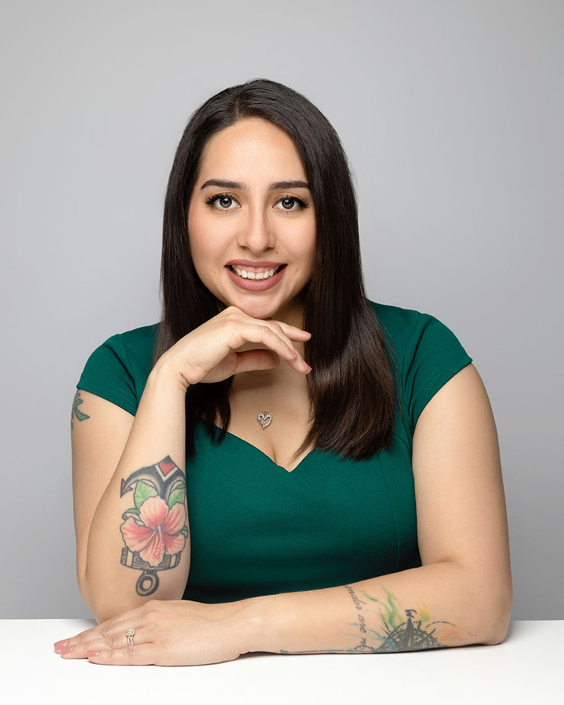 Professional headshot for Officiant Yomayra Ramirez, she smiles at the camera