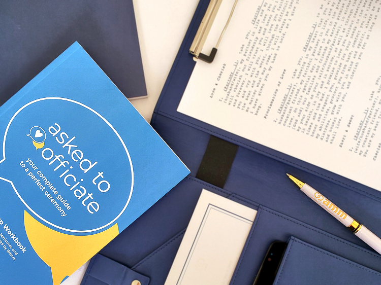 Product photo shows American Marriage Ministries' unique wedding ceremony planning guide book and other officiant supplies