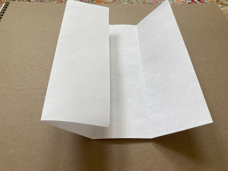 how to fold a zine, fold second side in toward middle crease