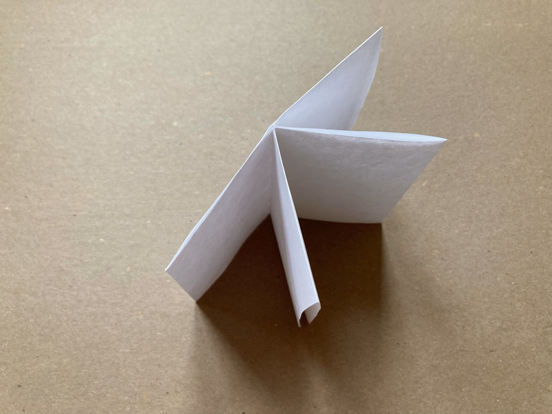 how to fold a zine, push sides together and fold into a booklet