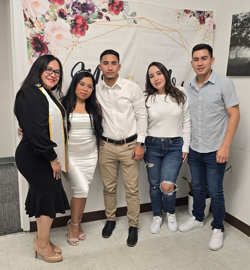 wedding officiant stands next to the newlyweds and their 2 friends