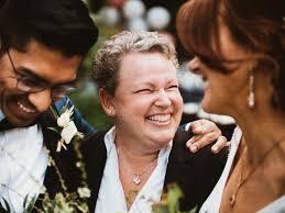 Officiant Bethel with a bride and groom, smiling and laughing on the wedding day