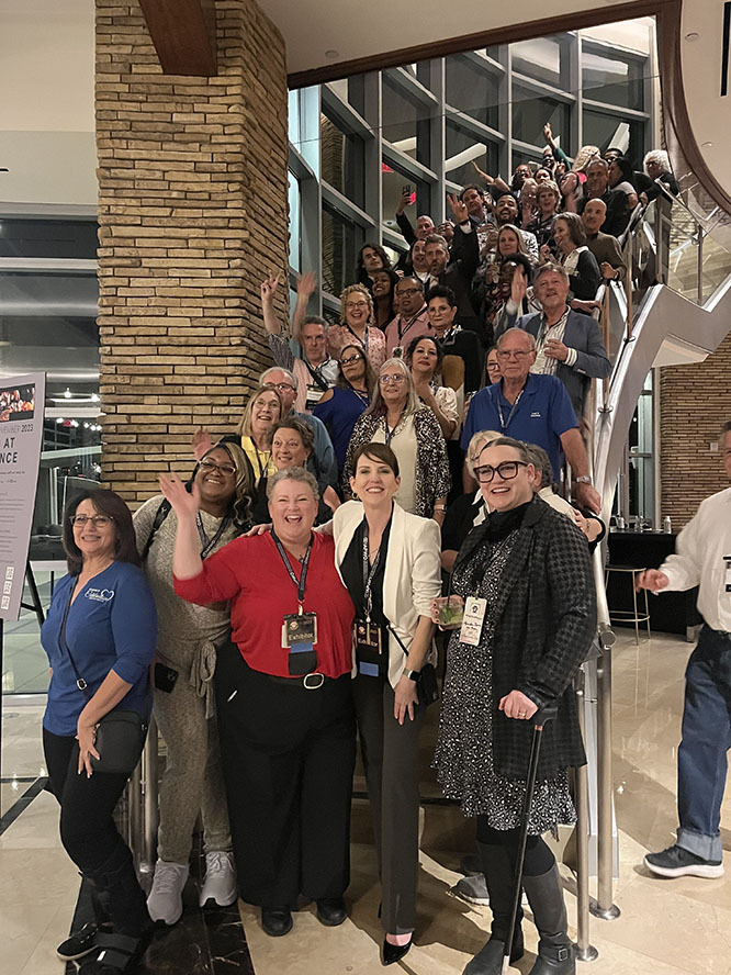 A group of wedding professionals pose for a photo at Wedding MBA 2024