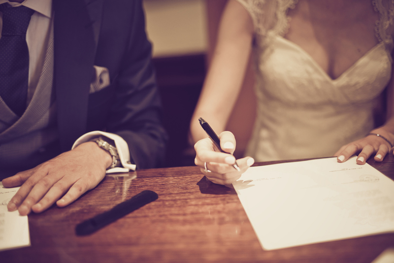 newlyweds sign the marriage license after elopement