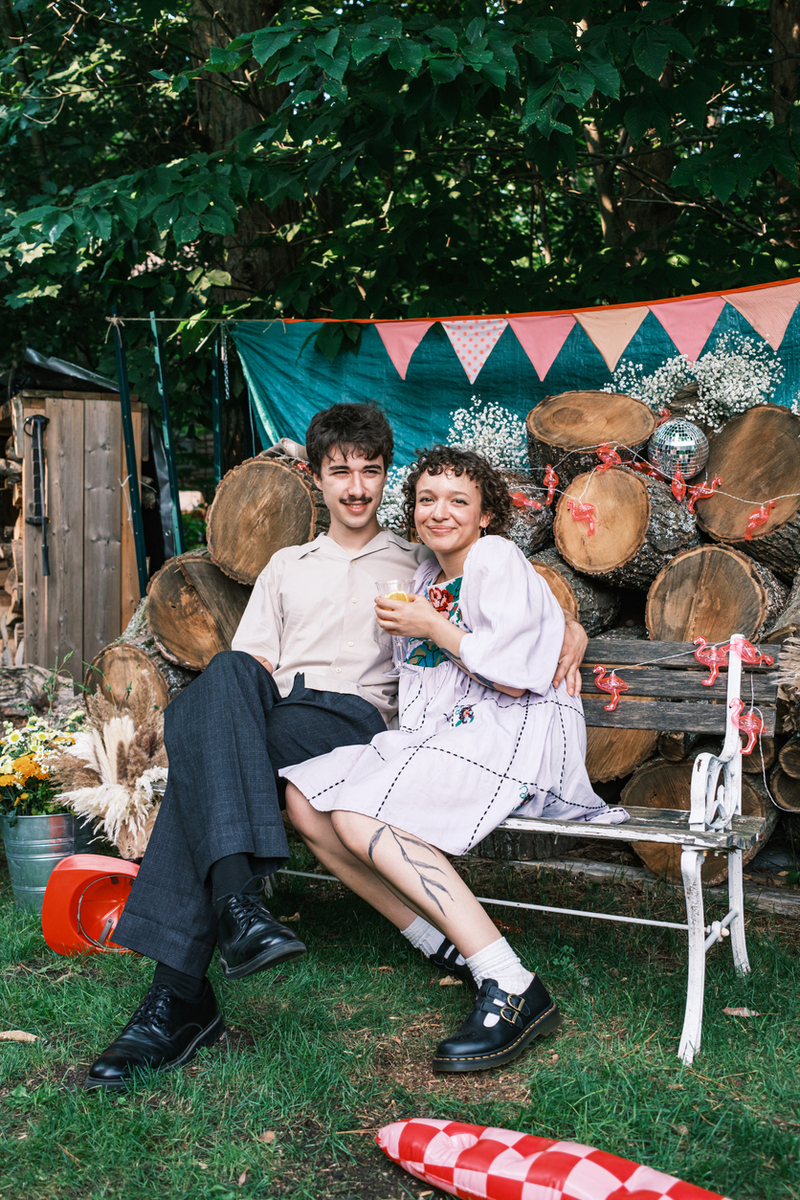 Young newlyweds in casual backyard wedding reception party