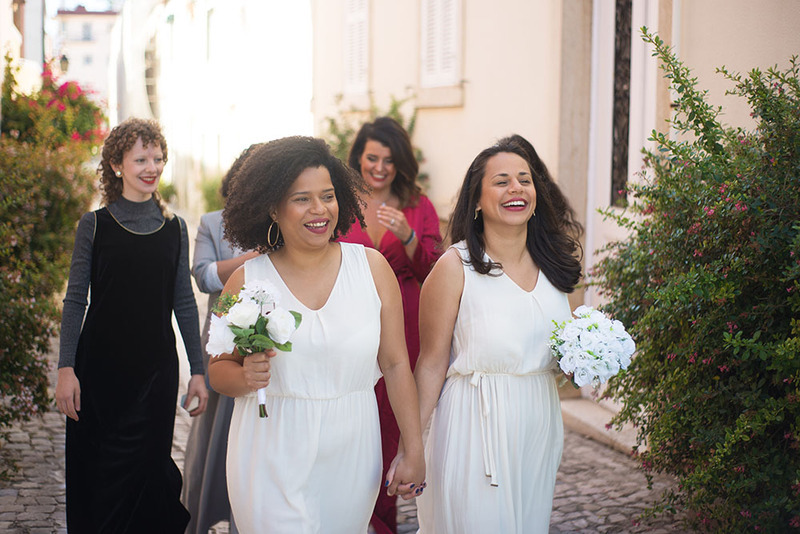 two brides in simple white dresses for second marriage wedding