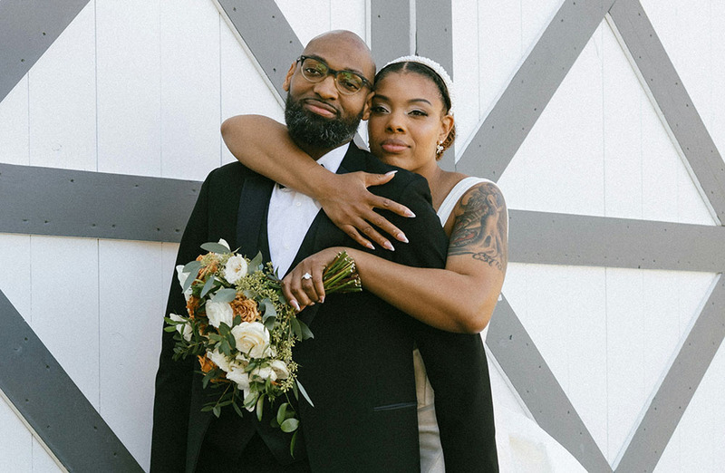 Husband and wife embrace on wedding day