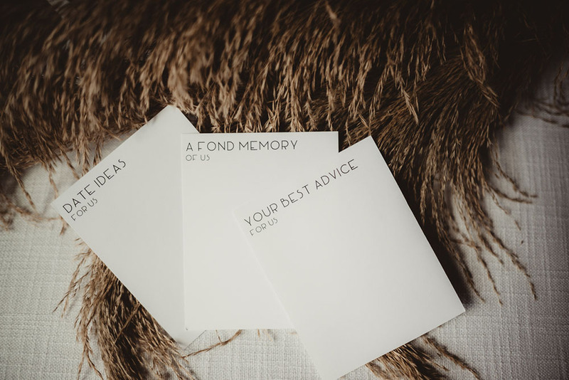 three blank stationary pads labeled "date ideas for us", "your best advice for us" etc