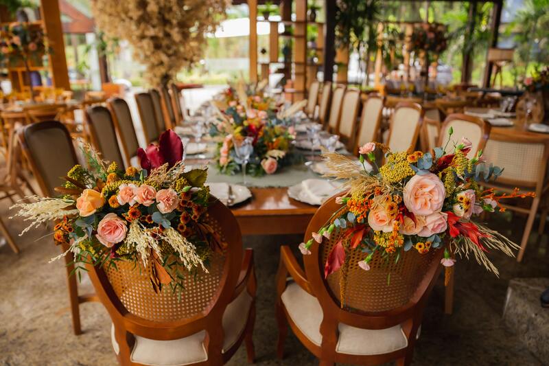 close up of chairs decorated for wedding reception