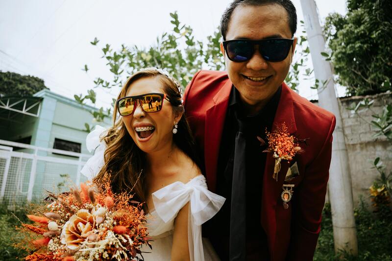 happy bride and groom smiling at wedding