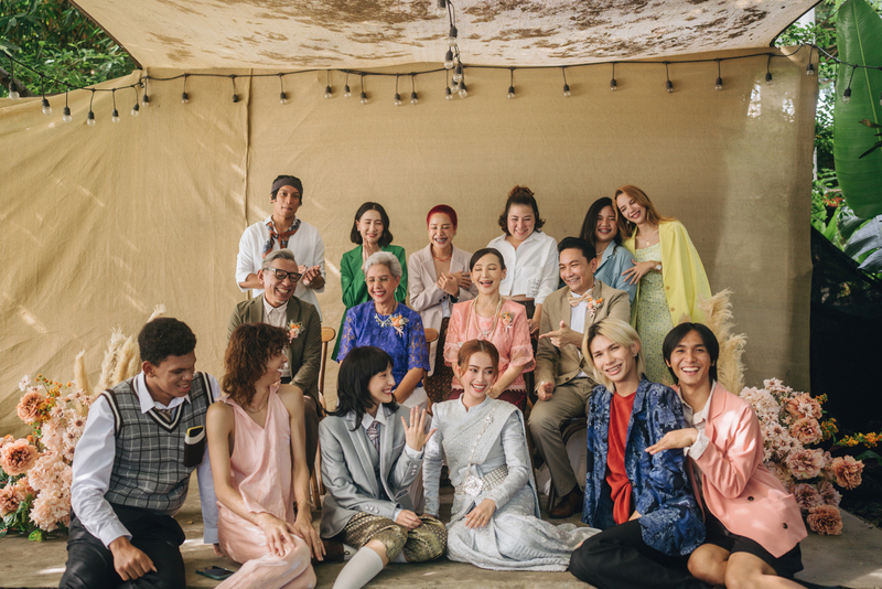 gender diverse wedding party, everyone posing smiling