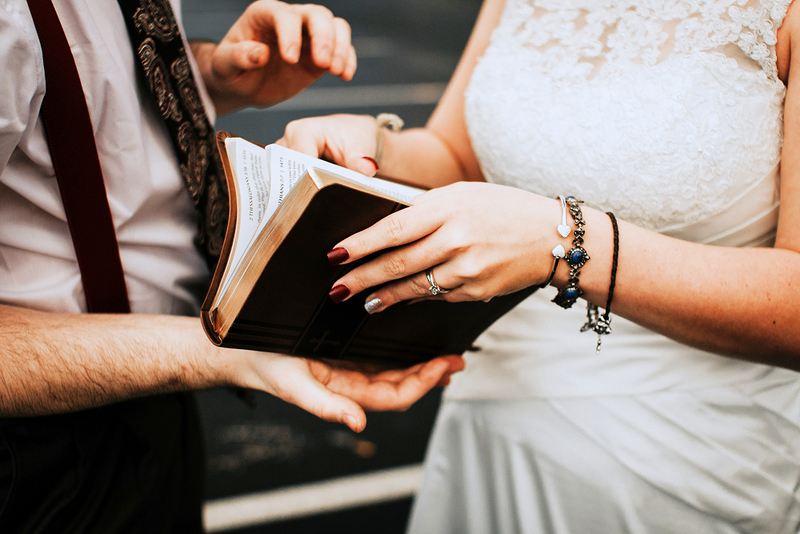 bride and groom reading selection at wedding ceremony, tradition and culture, how to officiate a wedding