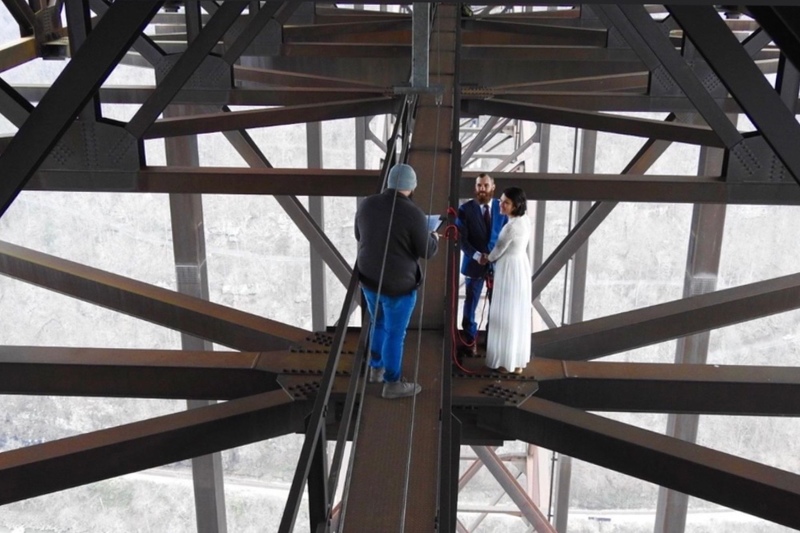 Officiant Mathew Anderson performs wedding ceremony on New River Bridge