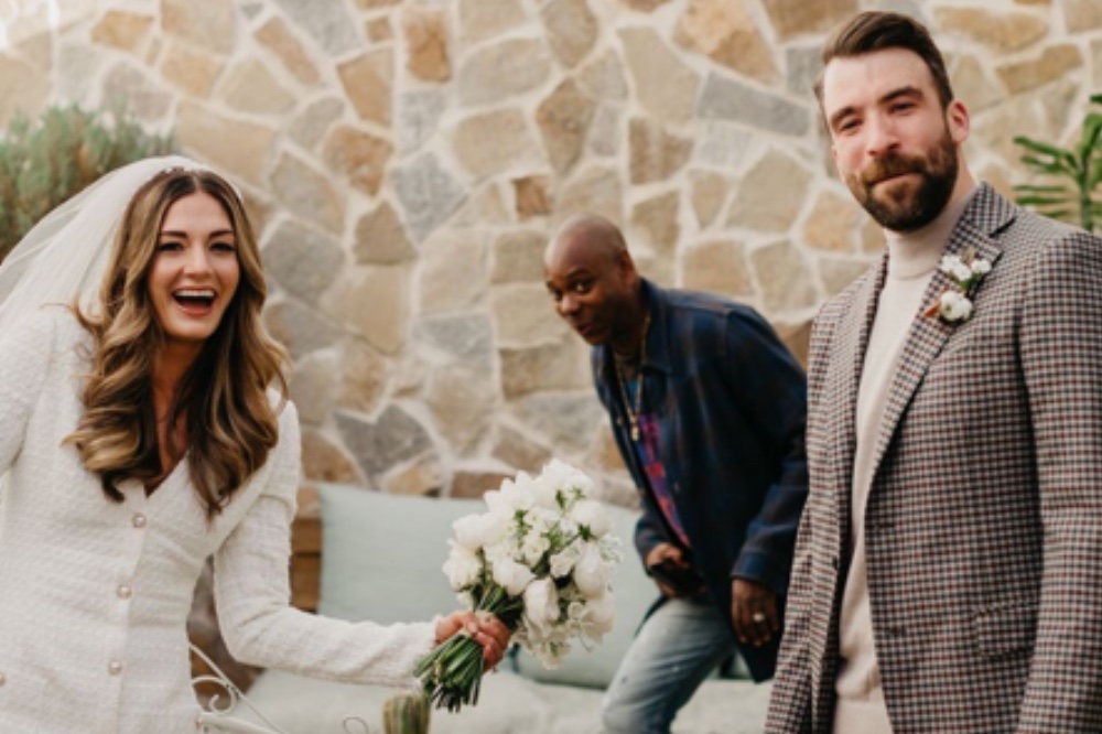 Dave Chappelle photobombs a First Look wedding photo! Plus, a look back at some of our favorite celebrity wedding crashers. 