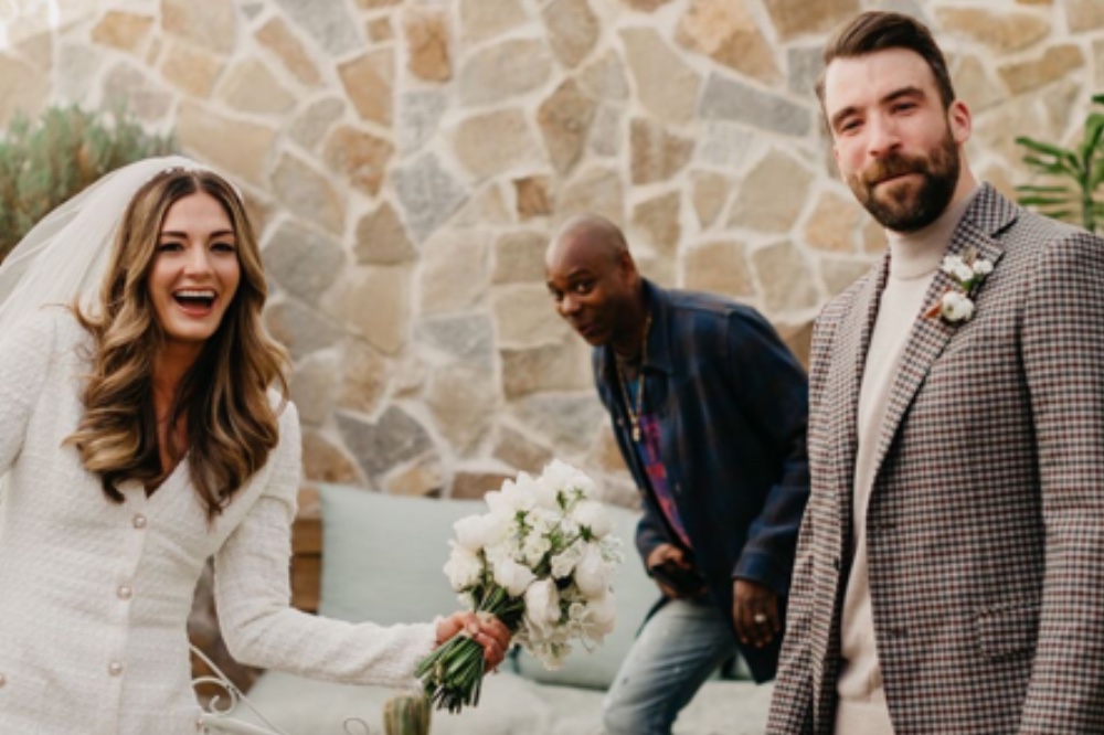 Cover photo of Dave Chappelle and the happy couple (cropped from original) by Anna Szczekutowicz, via Yahoo!Entertainment 