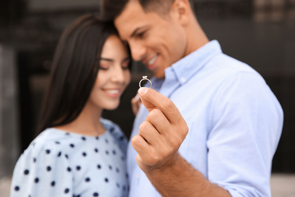 What do you call a man who is engaged? What do you call a woman who is engaged? (And what about gender neutral terms that say "I'm engaged!"?) Keep reading to learn your options!  (Photo: New Africa / Adobe Stock)