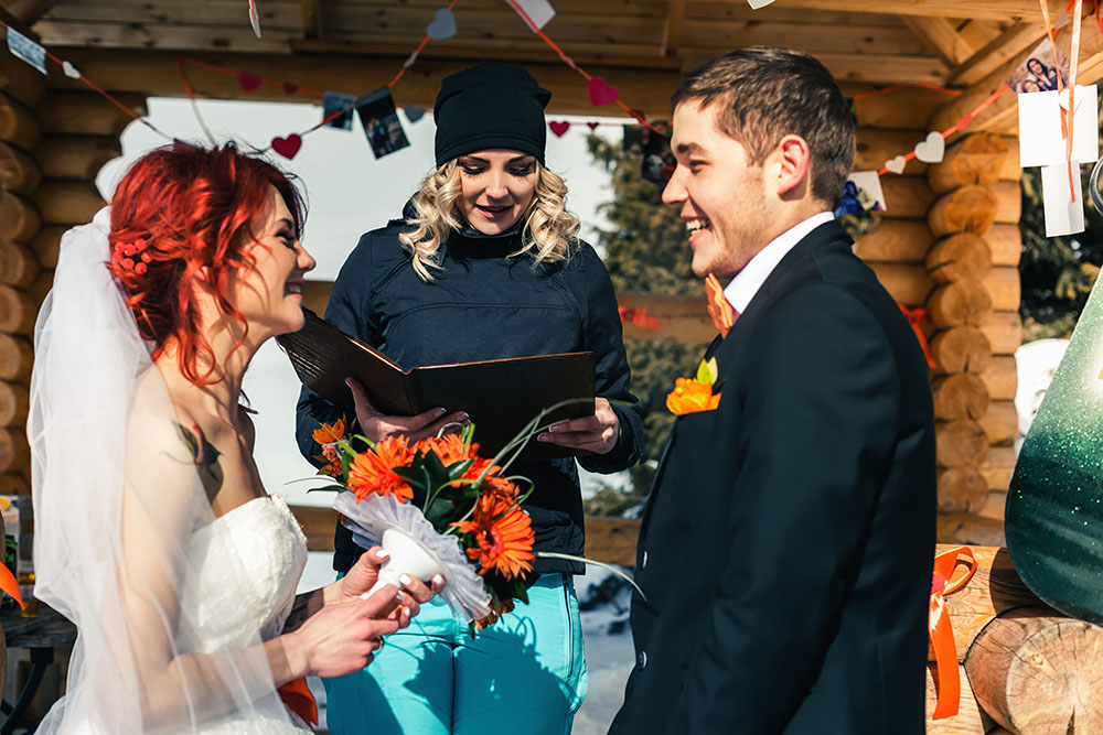 Hesitant about having a friend officiate your wedding ceremony? Consider these pros and cons when choosing a wedding officiant. (Photo: Pilin_Petunyia / iStock)