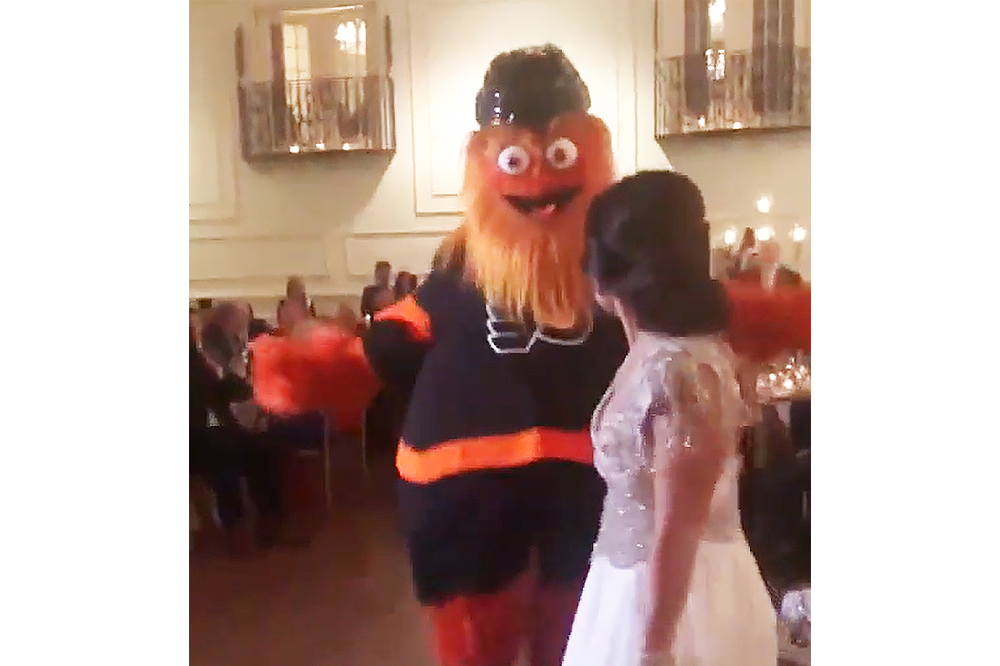 (Screenshot: Gritty crashes a wedding to dance with the bride, screenshot; watch the full video and Gritty's dance moves here.) 