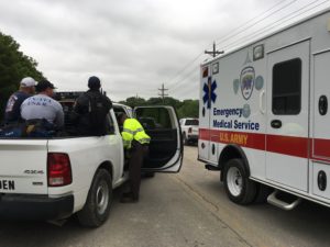 Fort Hood DES and Texas Task Force One search and rescue personnel coordinate their search efforts at the staging area on Turkey Run Road April 12 looking for Fort Hood's missing person. (U.S. Army photo by Master Sgt. Mary Mittlesteadt)