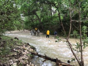Fort Hood DES, U.S. Army Criminal Investigation Command and 89th Military Police Brigade search and rescue personnel enter House Creek here search downstream for Clear Creek April 12 looking for Fort Hood's missing person. (U.S. Army photo by Master Sgt. Mary Mittlesteadt)