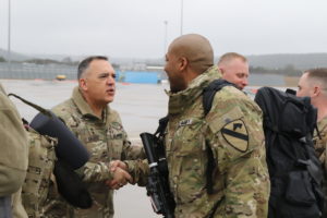 Maj. Gen. Paul T. Calvert, 1st Cavalry Division commanding general, shakes hands of First Team Troopers from the division headquarters on Feb. 10, 2019 as they depart Fort Hood for their deployment to Kandahar, Afghanistan.