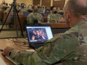 CSM Burgoyne speaks with Simon Sinek during a professional development session