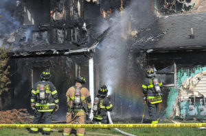Fort Lee firefigters extinguish a fire April 20 in the jackson Circle neighborhood.
