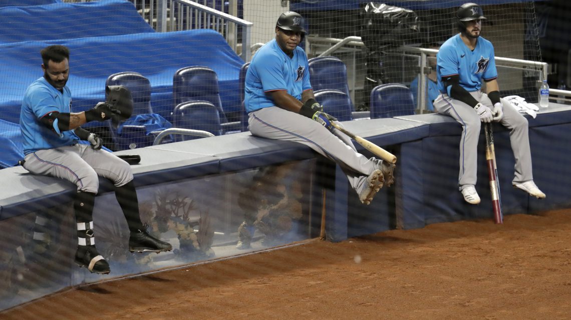 Virus-stricken Marlins resume season with 18 new players