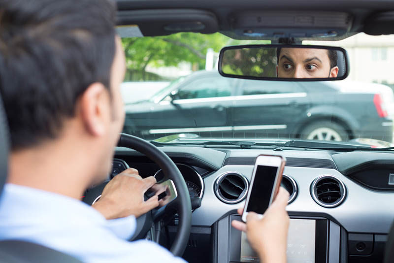 young driver texting shutterstock
