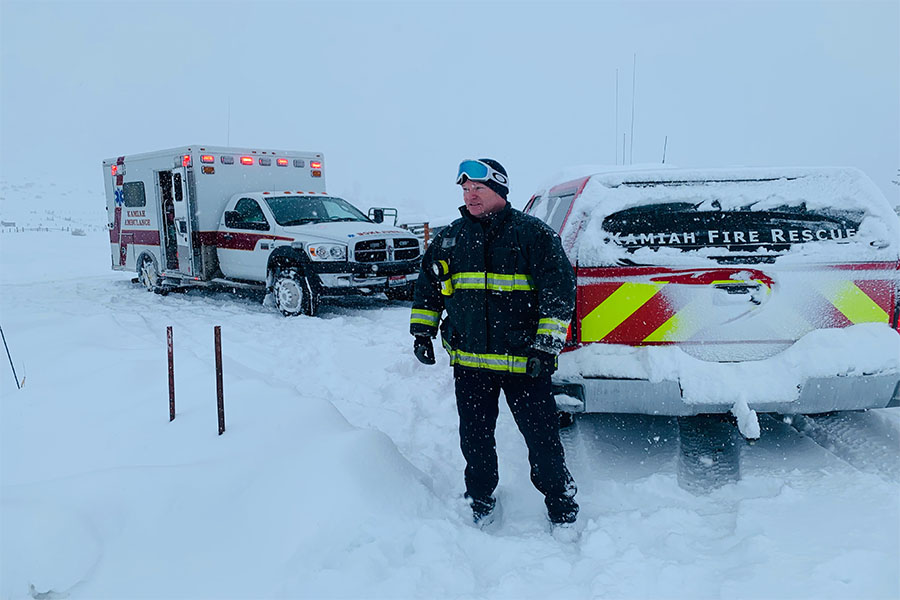 First responders fight snowstorm, fallen trees on highway while caring