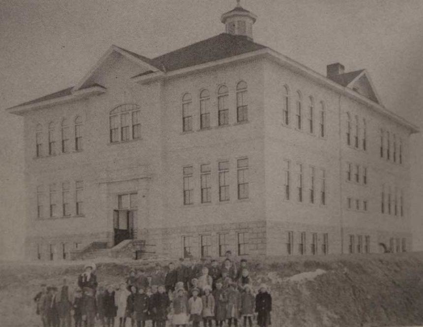 Group of kids standing in front of Eastside Elementary, Eastern Idaho in 1911