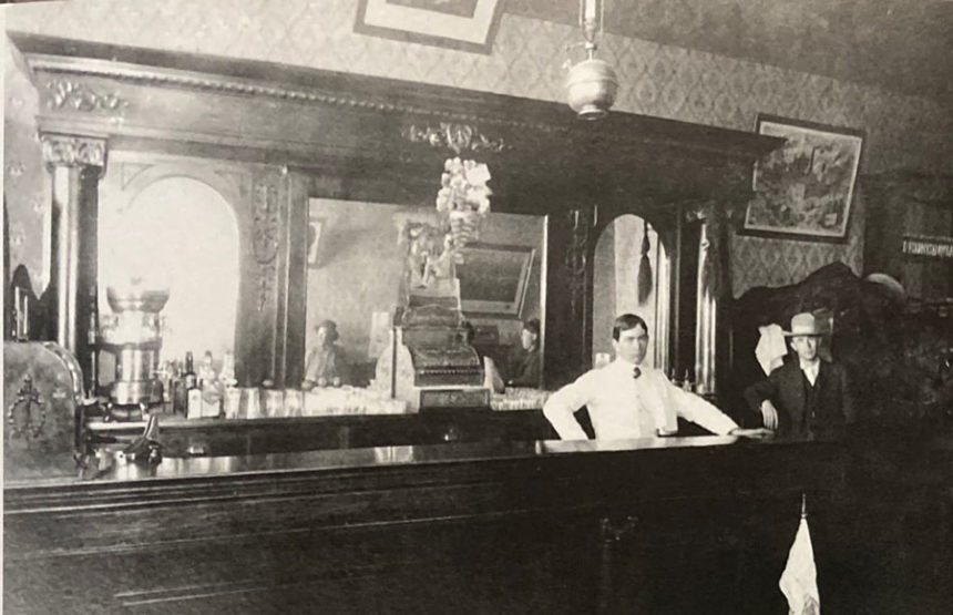Two men in the Herman Layman Saloon and Pool Hall in Rexburg, in 1900.
