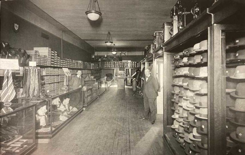 Edward Rowles in the Rowles Mack Company building in Idaho Falls in 1913. Hats and other articles pictured.