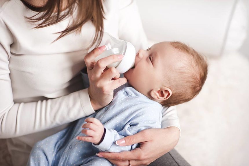 baby drinking from bottle