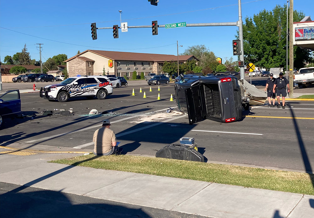 Pickup tips, boat flies off trailer after crash at Rexburg intersection