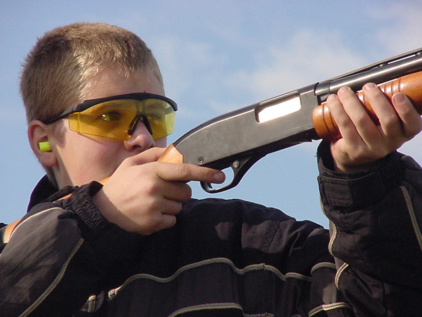 kid and shotgun closeup 0