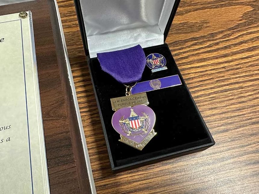Two sheriff sergeants presented with Law Enforcement Purple Hearts
