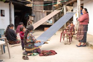 Guatemalan-women-and-children-of-the-weaving-cooperative-that-partners-with-the-root-collective-women-weaving