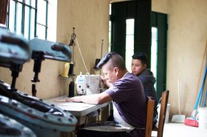 young-guatemalan-men-sewing