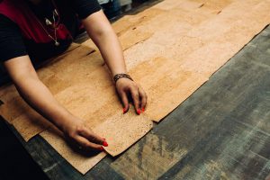 hands-assembling-yoga-mat-cork-yoga-mat-corc-yoga-mat