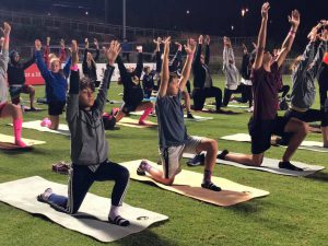 young-boys-doing-yoga-on-corc-yoga-mats-young-boys-in-yoga-pose-doing-yoga-on-sports-field