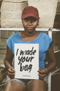 malagasy-woman-holding-sign-I-made-your-bag