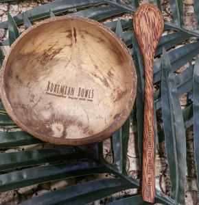 bohemian-bowl-and-spoon-on-palm-leaves-displaying-logo