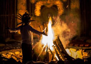 mayan-man-holding-ceremony-by-bonfire