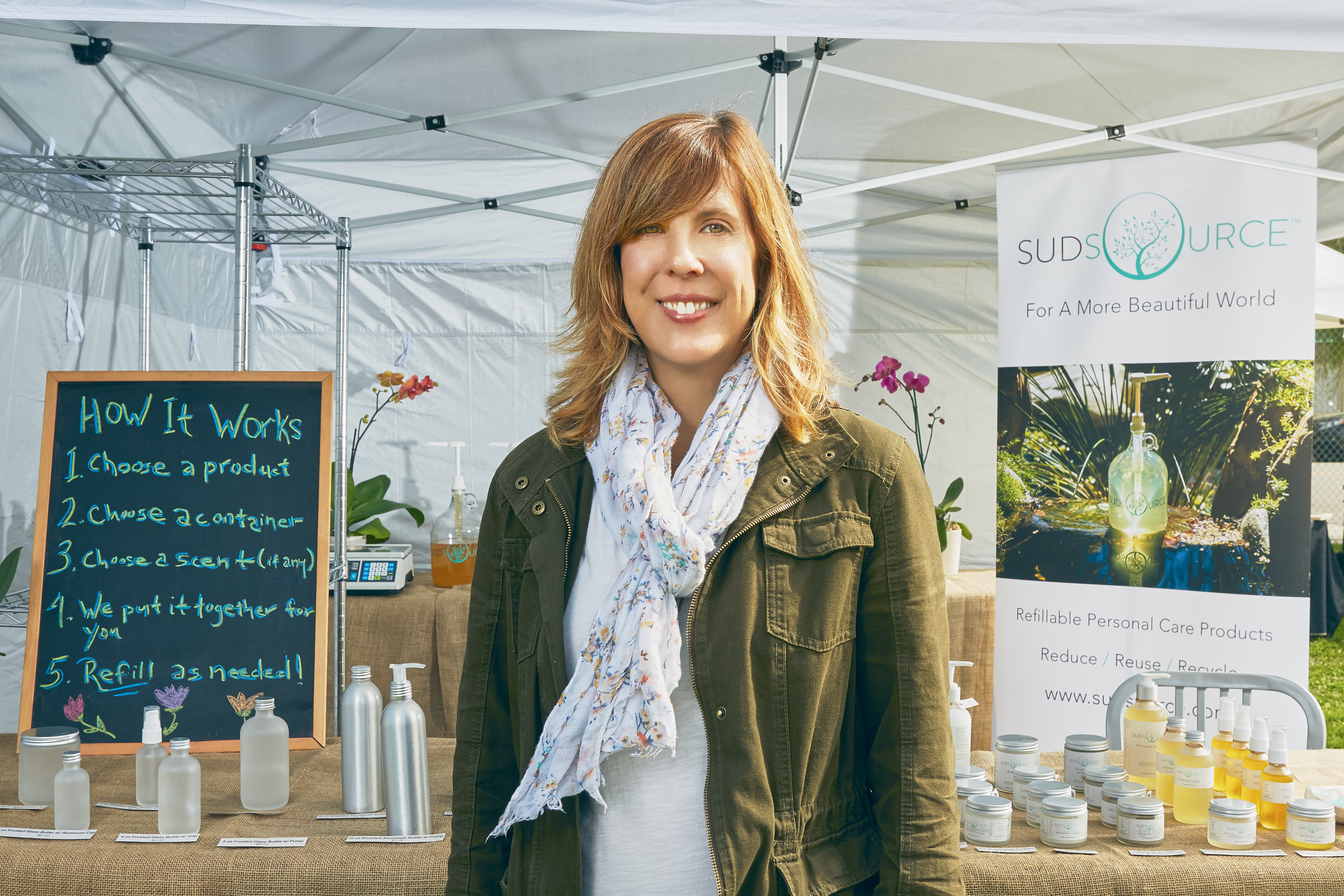 sudsource-founder-kathleen-o'clock-at-sudsource-stand-with-products-displayed