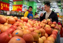 China raises tariffs on US pork, fruit in trade dispute